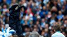 Manchester City's manager Manuel Pellegrini is thrown into the air by his team as they celebrate winning the English Premier League trophy following their soccer match ag