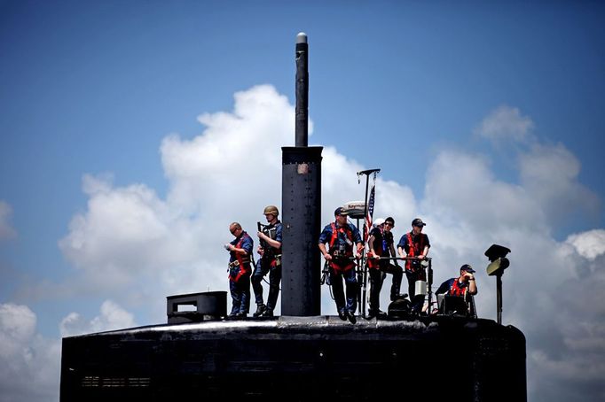 April 24, 2011 - Cape Canaveral, Florida, U.S. - -- Cape Canaveral, Fla. -- Commander John Gearhart, center, on the bridge with submariners aboard the USS Annapolis (SSN 760), a S6G nuclear reactor powered fast attack submarine, moored at Port Canaveral in Cape Canaveral on Sunday. The USS Annapolis measures 362 ft. in length and 33 ft. at the beam, a diving depth of over 400 ft., 27+ mph, 12 vertical launch missile tubes, 4 torpedo tubes, and a crew of 130 submariners. The submarine was commissioned April 11, 1992 with its homeport in Groton, Connecticut. (Credit Image: © Gary Coronado/The Palm Beach Post)