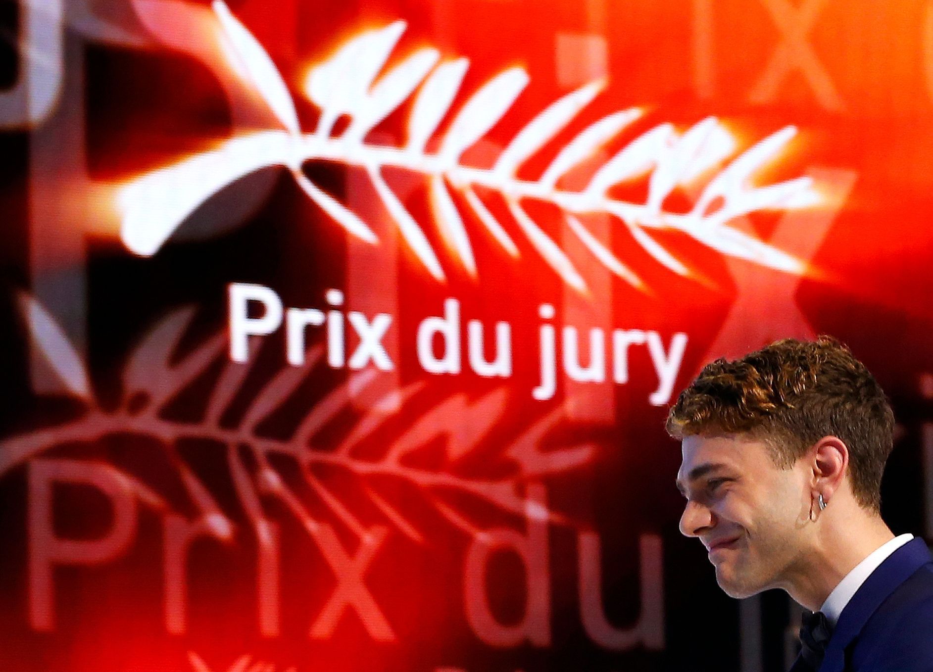 Director Xavier Dolan, Jury Prize award winner for his film &quot;Mommy&quot;, arrives on stage during the closing ceremony of the 67th Cannes Film Festival in Cannes