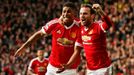 Manchester United's Marcus Rashford celebrates scoring their first goal with Juan Mata