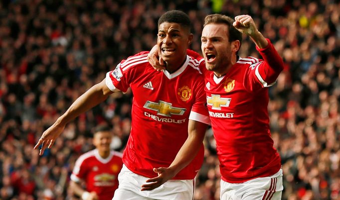 Manchester United's Marcus Rashford celebrates scoring their first goal with Juan Mata