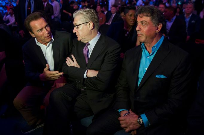 (L-R) Actor Arnold Schwarzenegger, Sands China Ltd. President and CEO Edward Tracy, and actor Sylvester Stallone attend the WBO world welterweight title boxing match betw