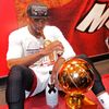 Heat's Wade sits with the Larry O'Brien Trophy after his tea