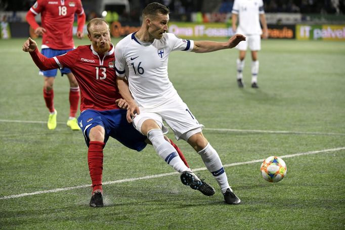 Soccer Football - Euro 2020 - Group J Qualification - Finland v Liechtenstein - Helsinki, Finland November 15, 2019. Juha Pirinen of Finland vies with Martin Buchel of Li