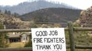 A sign is placed near where the High Park fire has burned out, west of Fort Collins, in Colorado June 18, 2012. The fire has charred more than 85 square miles (200 square km) and sent a plume of smoke billowing thousands of feet into the air. The lightning-sparked blaze has destroyed 181 homes since it was reported June 9, ranking it as the most destructive wildfire on record in Colorado. REUTERS/Rick Wilking (UNITED STATES - Tags: DISASTER ENVIRONMENT) Published: Čer. 18, 2012, 11:30 odp.