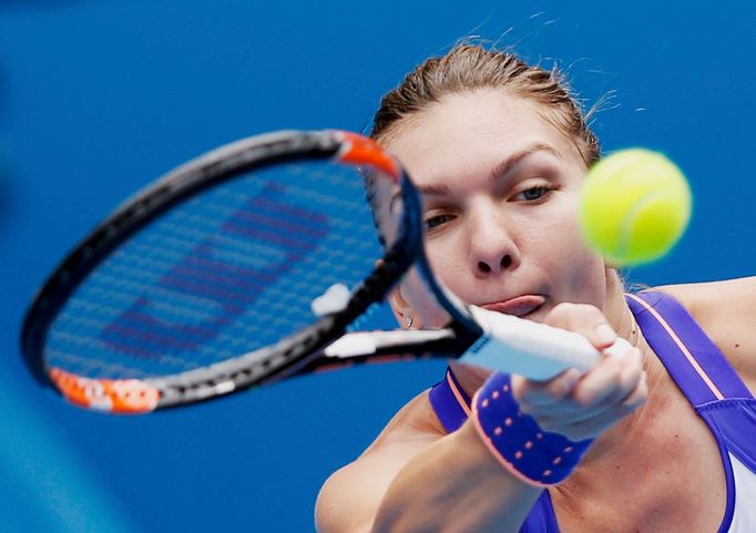 Simona Halep of Romania hits a return to Ekaterina Makarova of Russia during their women's singles quarter-final match at the Australian Open 2015 tennis tournament in Me