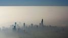 Blue sky is seen over a blanket of fog enveloping the skyline of Chicago, as photographed from an airplane window November 21, 2012. Unseasonably warm temperatures created a heavy fog along Chicago's Lake Michigan. The blue line is formed by the clouds and fog meeting the sky. REUTERS/Kevin Lamarque (UNITED STATES - Tags: SOCIETY CITYSPACE ENVIRONMENT) Published: Lis. 22, 2012, 1:12 dop.