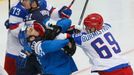 Russia's Alexander Burmistrov (R) fights with Finland's Miikka Salomaki during the first period of men's ice hockey World Championship final game at Minsk Arena in Minsk