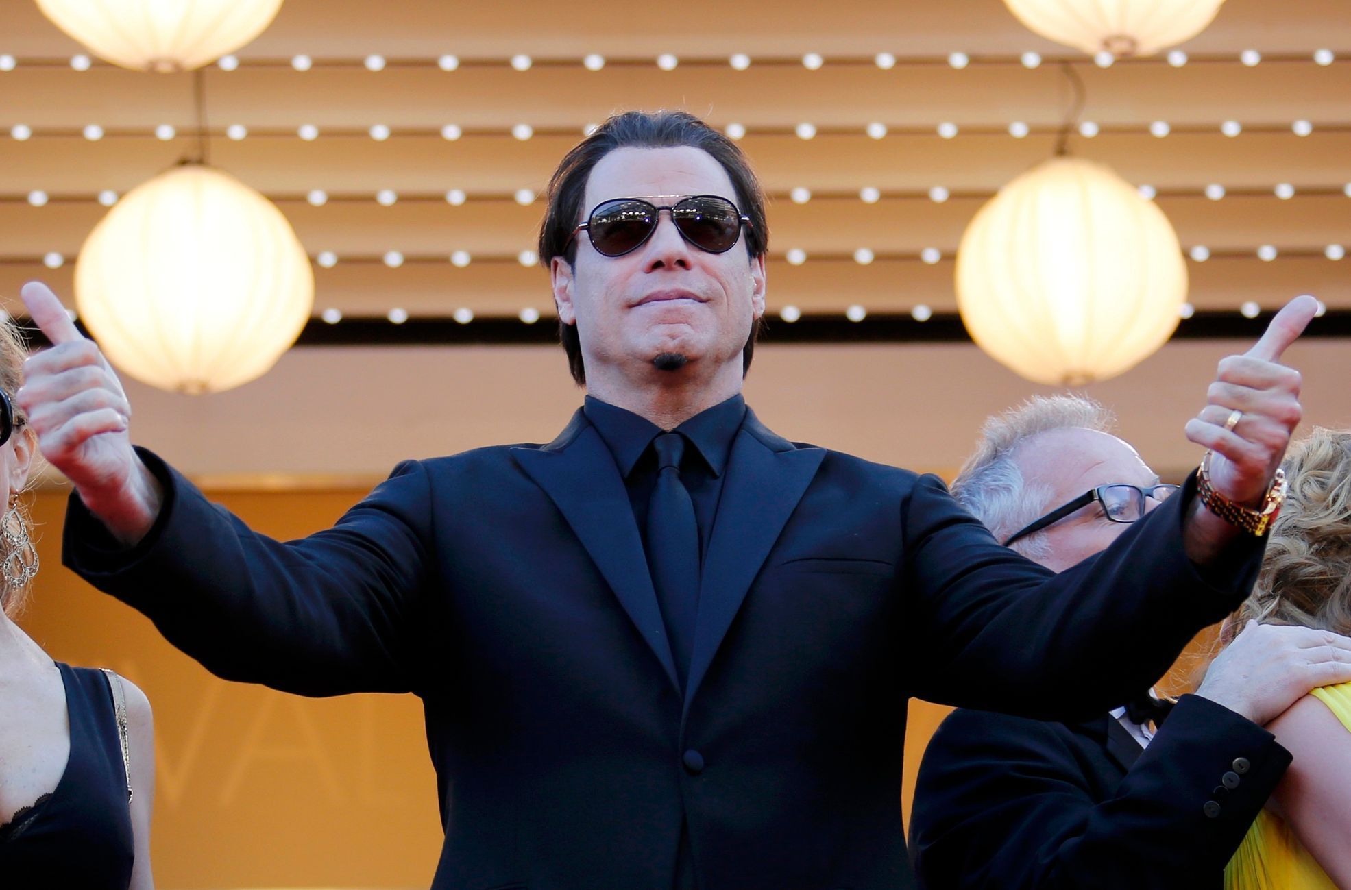 Actor John Travolta poses on the red carpet he arrives for the screening of the film &quot;Sils Maria&quot; in competition at the 67th Cannes Film Festival in Cannes