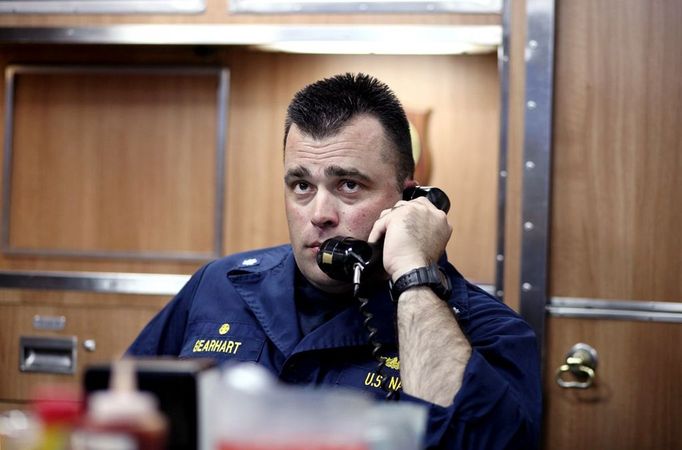 April 24, 2011 - Cape Canaveral, Florida, U.S. - -- Cape Canaveral, Fla. -- Commander John Gearhart, in the wardroom, speaks with the control room during lunch aboard the USS Annapolis (SSN 760), a S6G nuclear reactor powered fast attack submarine, sailing from Port Canaveral in Cape Canaveral on Sunday. The USS Annapolis measures 362 ft. in length and 33 ft. at the beam, a diving depth of over 400 ft., 27+ mph, 12 vertical launch missile tubes, 4 torpedo tubes, and a crew of 130 enlisted submariners. The submarine was commissioned April 11, 1992 with its homeport in Groton, Connecticut. USS Annapolis sailed to the 21st Anniversary of Fleet Week at Port Everglades, Fort Lauderdale. (Credit Image: © Gary Coronado/The Palm Beach Post) (