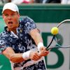 Tomas Berdych of the Czech Republic returns the ball to Ernests Gulbis of Latvia during their men's quarter final match at the French Open Tennis tournament at the Roland Garros stadium in Paris