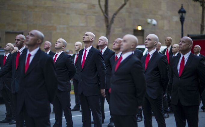 People pose for a photo while promoting the movie &quot;Hitman: Agent 47&quot; during the 2015 Comic-Con International Convention in San Diego