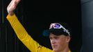 Team Sky rider Christopher Froome of Britain celebrates his leader's yellow jersey on the podium after he won the 195 km eight stage of the centenary Tour de France cycli