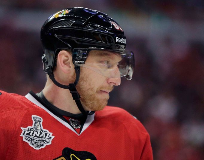 Chicago Blackhawks right wing Marian Hossa (81) looks out from his helmet as he plays against the Boston Bruins during Game 1 of their NHL Stanley Cup Finals hockey serie