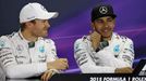 Mercedes Formula One driver Nico Rosberg of Germany (L) and team mate Lewis Hamilton of Britain attend a news conference following the qualifying session of the Australia