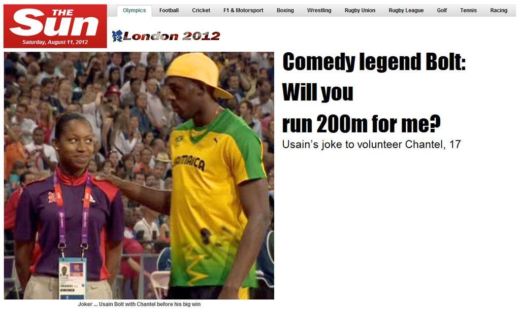 Usain Bolt laškuje s dobrovolnicí na stadionu