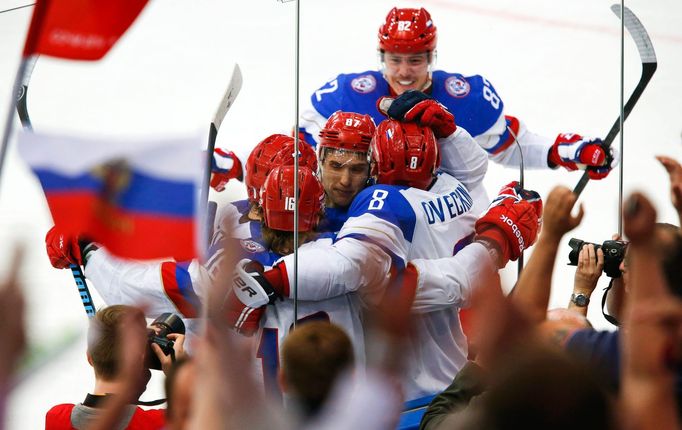 Russia's Sergei Plotnikov (16) celebrates with team mates his goal against Sweden during the first period of their men's ice hockey World Championship semi-final game at