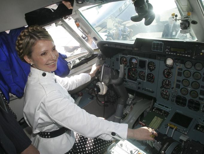 Ukrainian former Prime Minister Yulia Tymoshenko sits inside a cockpit of a plane as she visits the Le Bourget air salon near Paris in this June 2005 handout photo. Poland said on Thursday Ukraine's reputation would "suffer dramatically" if no humanitarian solution for the case of jailed ex-premier Yulia Tymoshenko were found, but criticised calls for a boycott of the pending European soccer tournament in Ukraine. REUTERS/Alexander Prokopenko/Yulia Tymoshenko Press Service/Handout (UKRAINE - Tags: POLITICS CRIME LAW TRANSPORT) FOR EDITORIAL USE ONLY. NOT FOR SALE FOR MARKETING OR ADVERTISING CAMPAIGNS. THIS IMAGE HAS BEEN SUPPLIED BY A THIRD PARTY. IT IS DISTRIBUTED, EXACTLY AS RECEIVED BY REUTERS, AS A SERVICE TO CLIENTS