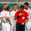 Spain's players crowd around referee Nicola Rizzoli of Italy in protest after the conceeded a goal to the Netherlands during their 2014 World Cup Group B soccer match against Spain at the Fonte Nova a
