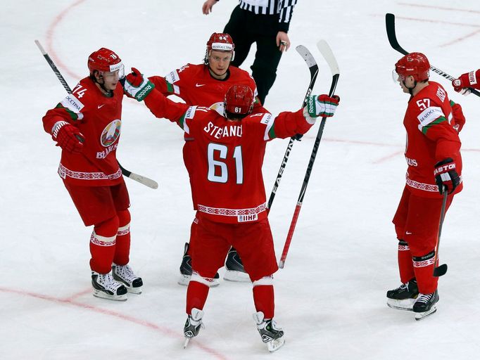 Andrei Stepanov of Belarus (C) celebrates with team mates his goal against the U.S. during the second period of their men's ice hockey World Championship Group B game at