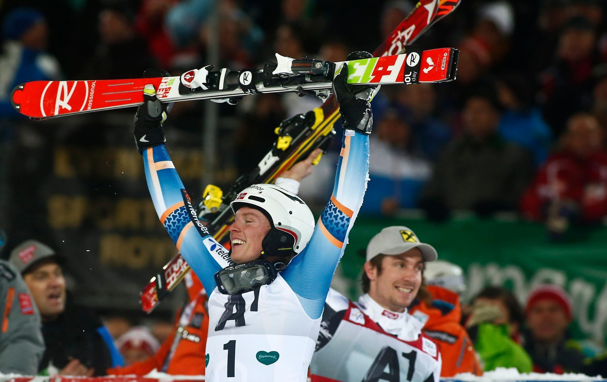 Kristoffersen of Norway reacts next to Austria's Hirscher after winning World Cup Men's Slalom race in Schladming