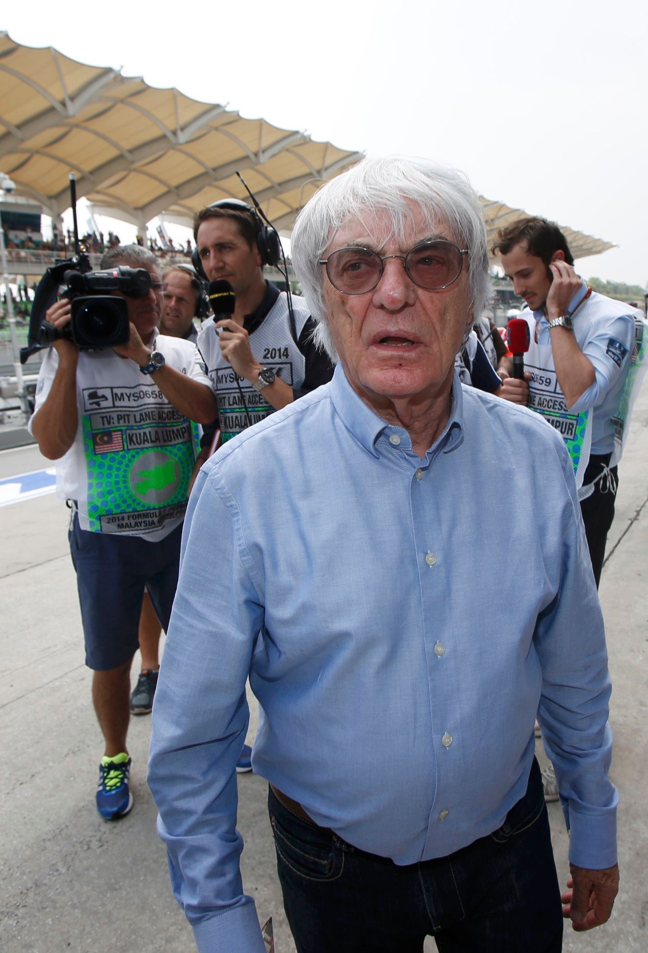 Formula One commercial supremo Ecclestone walks in the pit lane during the second practice session of the Malaysian F1 Grand Prix at Sepang International Circuit outside Kuala Lumpur
