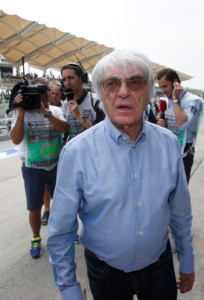 Formula One commercial supremo Bernie Ecclestone walks in the pit lane during the second practice session of the Malaysian F1 Grand Prix at Sepang International Circuit o