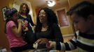 Mercedes Santos (2nd R) shares a laugh with her partner Theresa Volpe (2nd L) while playing cards with their son Jaidon (R) and daughter Ava at their home in Chicago, Illinois, December 22, 2012. Santos and Volpe are a same-sex couple raising two of their biological children as they struggle to get same-sex marriages passed into law in Illinois. Picture taken December 22, 2012. REUTERS/Jim Young (UNITED STATES - Tags: SOCIETY) Published: Bře. 25, 2013, 6:06 odp.