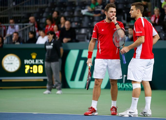 Marco Chiudinelli se Stanislasem Wawrinkou v nejdelším utkání Davis Cupu proti Čechům Tomáši Berdychovi s Lukášem Rosolem (Ženeva, 2013).