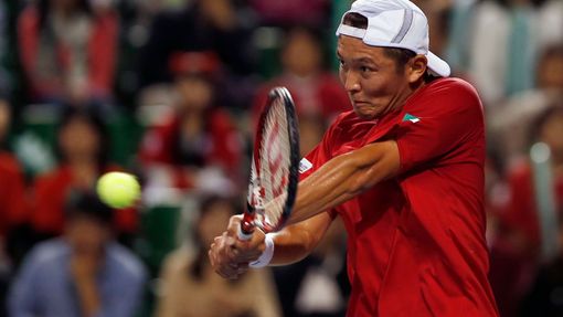 Japan's Ito returns a shot to Czech Republic's Stepanek during their Davis Cup quarter-final tennis match in Tokyo