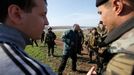 Ukrainian soldiers talk to pro-Russia protesters in the field near Kramatorsk, in eastern Ukraine April 16, 2014.