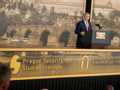 George Bush giving speech in Černín Palace in June 2007 with the Prague Castle wall paper behind his back