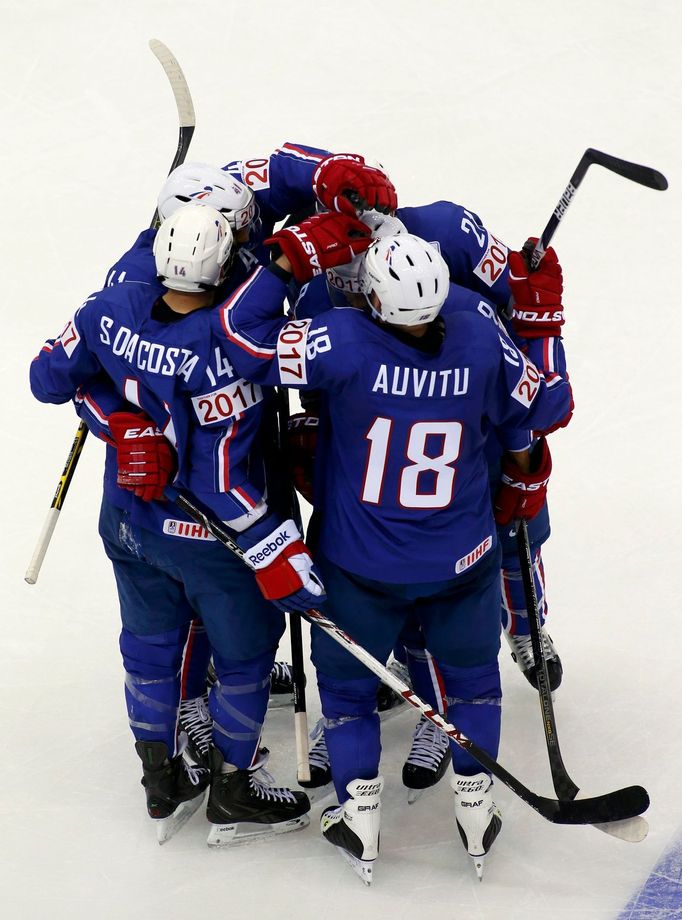 Stephane Da Costa of France (L) celebrates with team mates his goal against Canada during the first period of their men's ice hockey World Championship Group A game at Ch