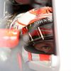 McLaren Formula One driver Jenson Button of Britain sits in his car in the team garage during the third practice session of the Australian F1 Grand Prix at the Albert Park circuit in Melbourne