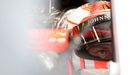 McLaren Formula One driver Jenson Button of Britain sits in his car in the team garage during the third practice session of the Australian F1 Grand Prix at the Albert Par