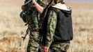 Female fighters of the Kurdish People's Protection Units (YPG) carry their weapons as they walk in the western countryside of Ras al-Ain January 25, 2015