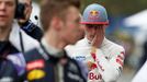 Toro Rosso Formula One driver Max Verstappen of the Netherlands (R) reacts after the qualifying session of the Australian F1 Grand Prix at the Albert Park circuit in Melb