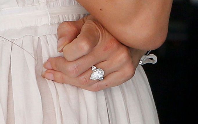 A ring is seen on the finger of Jessica Michibata, fiancee of McLaren Formula One driver Jenson Button, as she watches the first practice session of the Malaysian F1 Gran