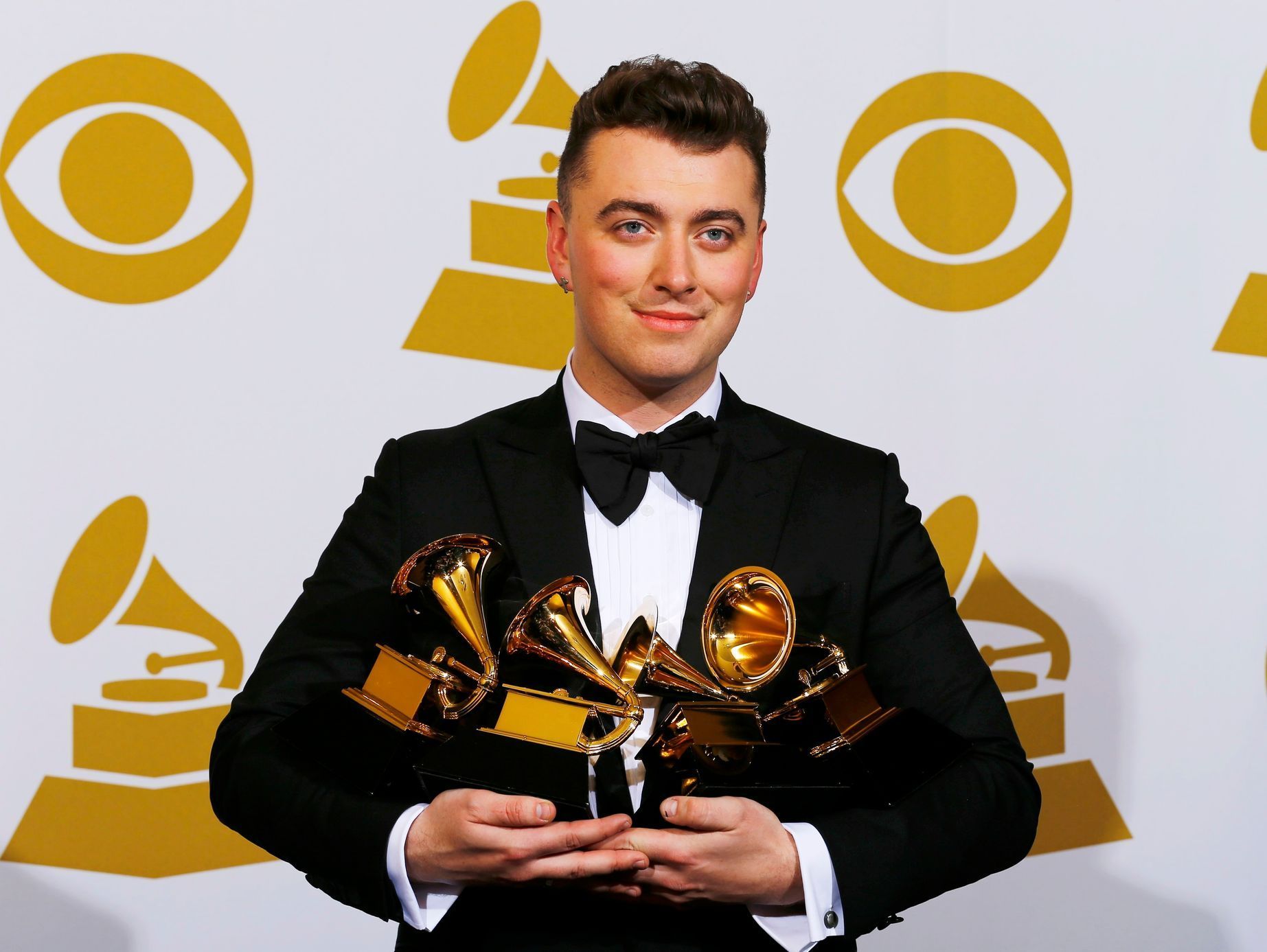 Sam Smith poses with his awards during the 57th annual Grammy Awards in Los Angeles