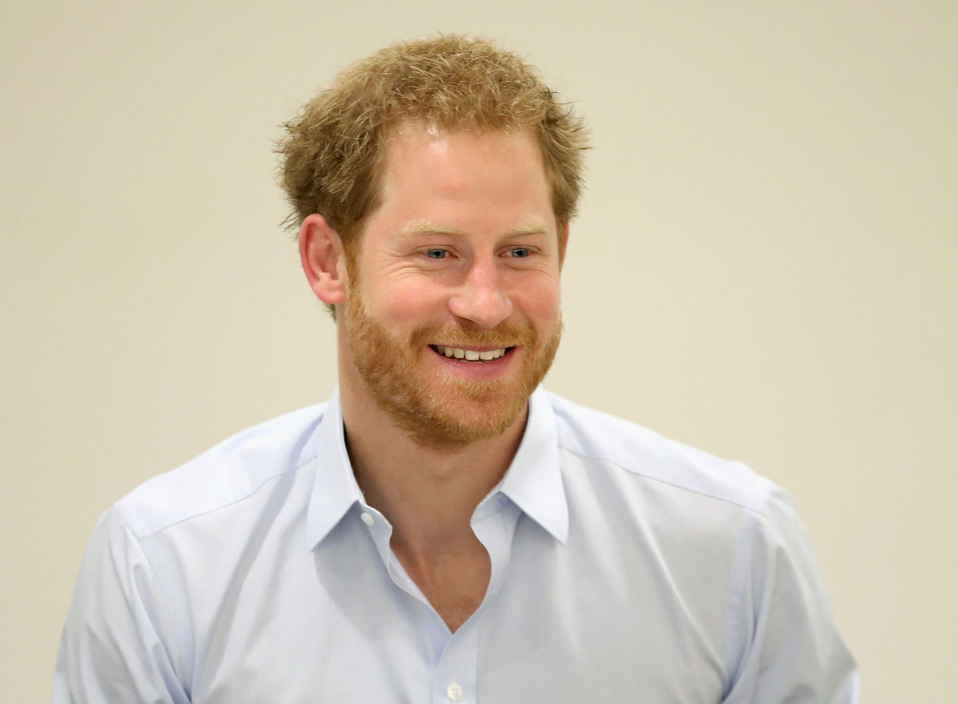 Prince Harry chats with staff during his visit to the Burrell Street Sexual Health Clinic in London.