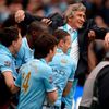 Manchester City's manager Pellegrini is carried by players as they celebrate winning the league after their English Premier League soccer match against West Ham United at the Etihad Stadium in Manches