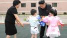 North Korean leader Kim Jong-Un (2nd R) visits Kyongsang Kindergarten in Pyongyang in this undated picture released by the North's KCNA July 15, 2012. REUTERS/KCNA (NORTH KOREA - Tags: POLITICS) THIS IMAGE HAS BEEN SUPPLIED BY A THIRD PARTY. IT IS DISTRIBUTED, EXACTLY AS RECEIVED BY REUTERS, AS A SERVICE TO CLIENTS. NO THIRD PARTY SALES. NOT FOR USE BY REUTERS THIRD PARTY DISTRIBUTORS Published: Čec. 15, 2012, 8:14 dop.