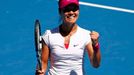 Li Na of China celebrates defeating Lucie Safarova of the Czech Republic during t