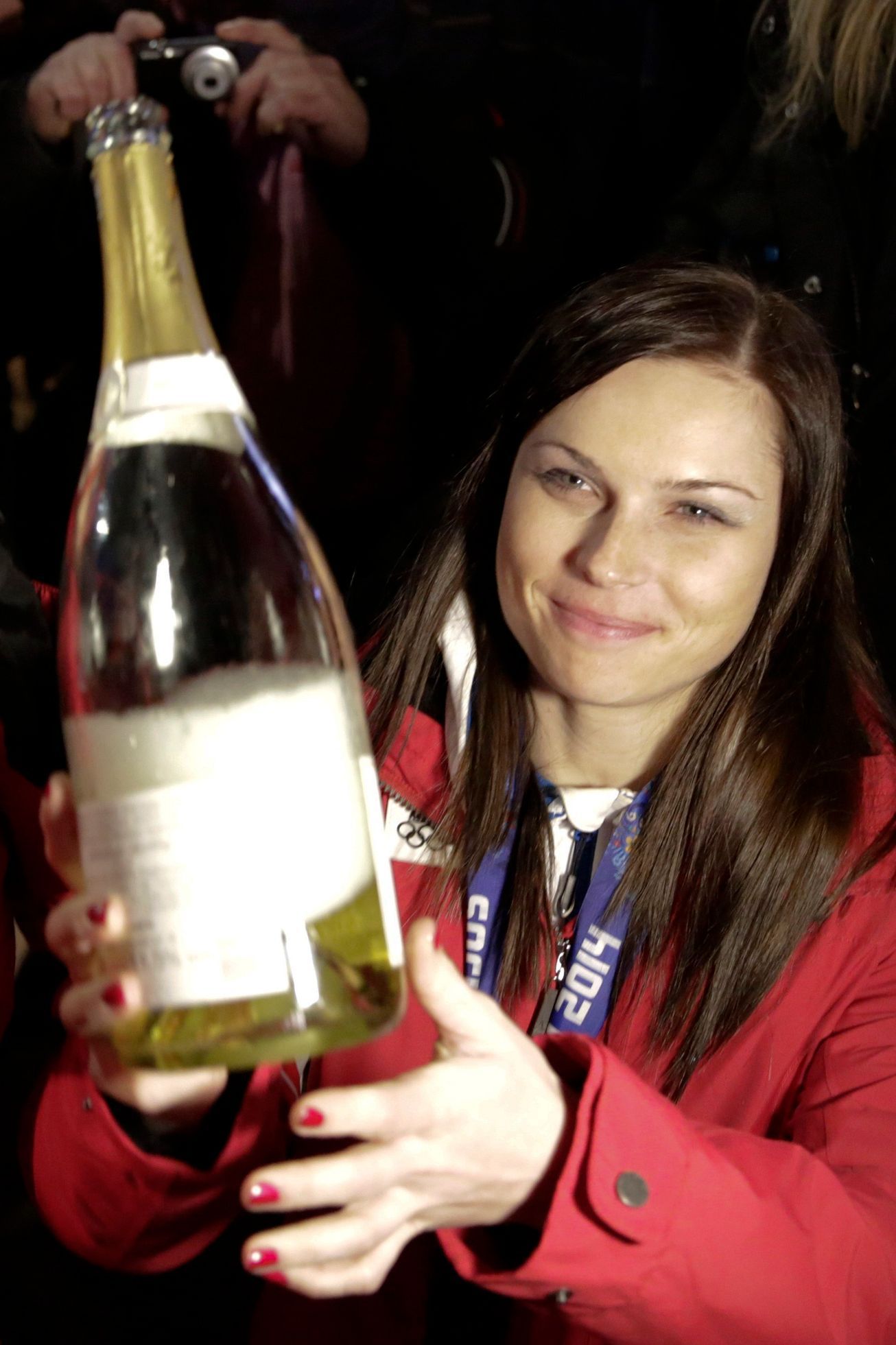 Austrian gold medallist Fenninger celebrates in the Austria house at the Sochi 2014 Winter Olympics