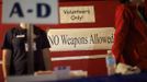 A "No Weapons Allowed" sign is posted at entrance to the Remote Area Medical (RAM) clinic in Wise, Virginia July 20, 2012. RAM clinics bring free medical, dental and vision care to uninsured and under-insured people across the country and abroad. The Wise clinic was the 647th RAM expedition since 1985 and drew 1700 patients from 14 states, organizers said. Picture taken July 20, 2012. REUTERS/Mark Makela (UNITED STATES - Tags: HEALTH SOCIETY) Published: Čec. 24, 2012, 3:02 odp.