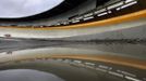 Latvia's Tomass Dukurs is seen on the track reflected in a puddle during the men's skeleton test event at the "Sanki" siding center in Rosa Khutor, a venue for the Sochi 2014 Winter Olympics near Sochi February 15, 2013. Although many complexes and venues in the Black Sea resort of Sochi mostly resemble building sites that are still under construction, there is nothing to suggest any concern over readiness. Construction will be completed by August 2013 according to organizers. The Sochi 2014 Winter Olympics opens on February 7, 2014. REUTERS/Kai Pfaffenbach (RUSSIA - Tags: BUSINESS CONSTRUCTION CITYSCAPE ENVIRONMENT SPORT OLYMPICS SKELETON TPX IMAGES OF THE DAY) Published: Úno. 15, 2013, 2:28 odp.