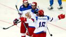 Russia's Danis Zaripov (C) celebrates his goal against Kazakhstan with team mates Sergei Plotinikov (R) and Viktor Tikhonov during the second period of their men's ice ho