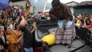 RNPS IMAGES OF THE YEAR 2012 - A woman hits a man with a stick after he is accused of theft along with three other men at Tactic, in the Alta Verapaz region, about 189 km (117 miles) from Guatemala City, September 13, 2012. The local community tied up and beat four men who were accused of theft in the aftermath of a school killing, which had occurred on Wednesday. The man, who had entered a classroom and killed two children, ages 8 and 13, with a machete, was lynched and burnt alive by a mob, local media reported. REUTERS/Jorge Dan Lopez (GUATEMALA - Tags: CRIME LAW SOCIETY) Published: Pro. 4, 2012, 1:07 dop.