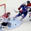 Goalkeeper Reimer and Read of Canada save in front of Bellemare of France during the first period of their men's ice hockey World Championship Group A game at Chizhovka Arena in Minsk
