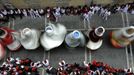 Performers dressed as oversized traditional figures dance through the streets during the San Fermin festival in Pamplona July 10, 2012. Visitors to the nine-day festival, depicted in Ernest Hemingway's 1926 novel "The Sun Also Rises", take part in activities including the running of the bulls, an early morning half-mile dash from the corral to the bullring alongside six bulls destined to die in the afternoon's corrida. This is followed by processions of giant traditional figures, concerts, firebulls, fireworks, and large doses of eating, drinking, dancing and late nights. REUTERS/Eloy Alonso (SPAIN - Tags: SOCIETY TPX IMAGES OF THE DAY) Published: Čec. 10, 2012, 9:50 dop.